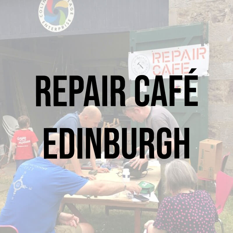 Members of the Repair Café Edinburgh working together outside on a woodent table